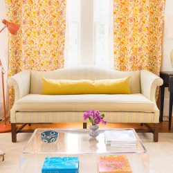 living room with Camel Back Sofa with Upholstery Fabric