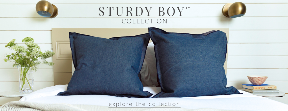 Sturdy Boy Collection Banner Sturdy Boy Flange Pillows on bed