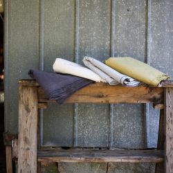 Sturdy Girl Fabric on a stand near a shed